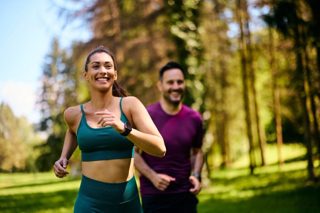 Proven Weight Loss Tips for Lasting Results happy,athletic,couple,jogging,while,exercising,in,nature.,focus,is